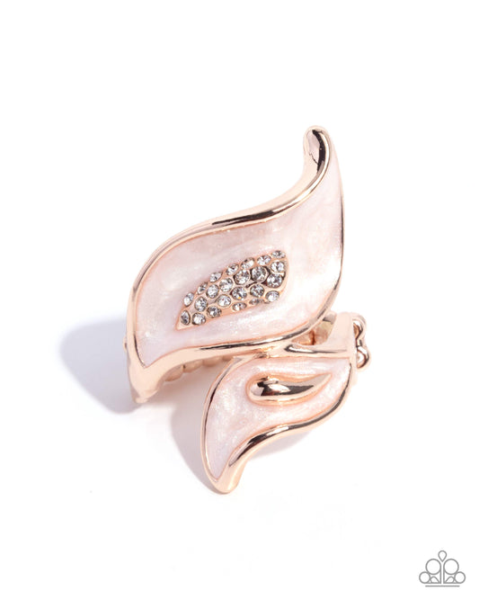 Rose gold and white leaf-shaped earring with gemstone detail on a white background
