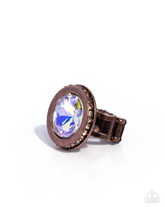 Copper ring with a large gemstone on a white background