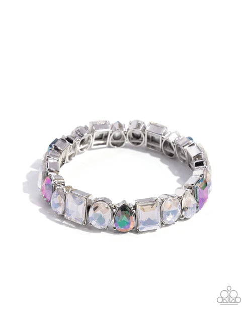Silver ring with multicolored gemstones on a white background