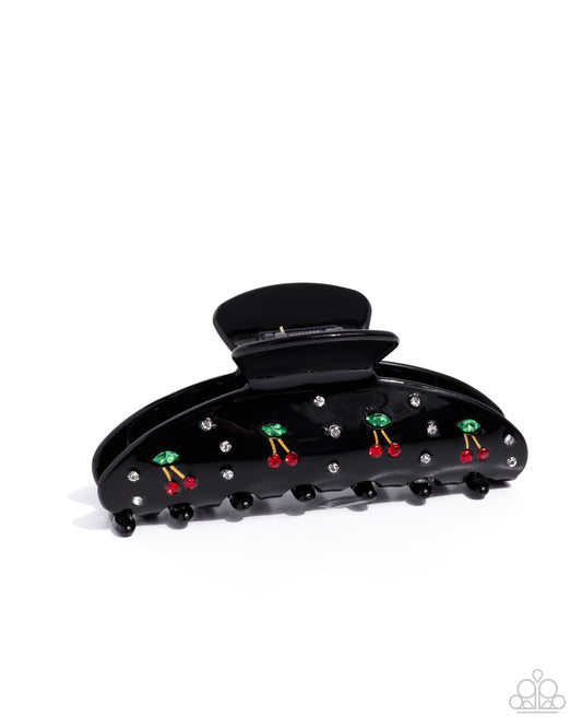 Black hair clip with colorful gemstones on a white background