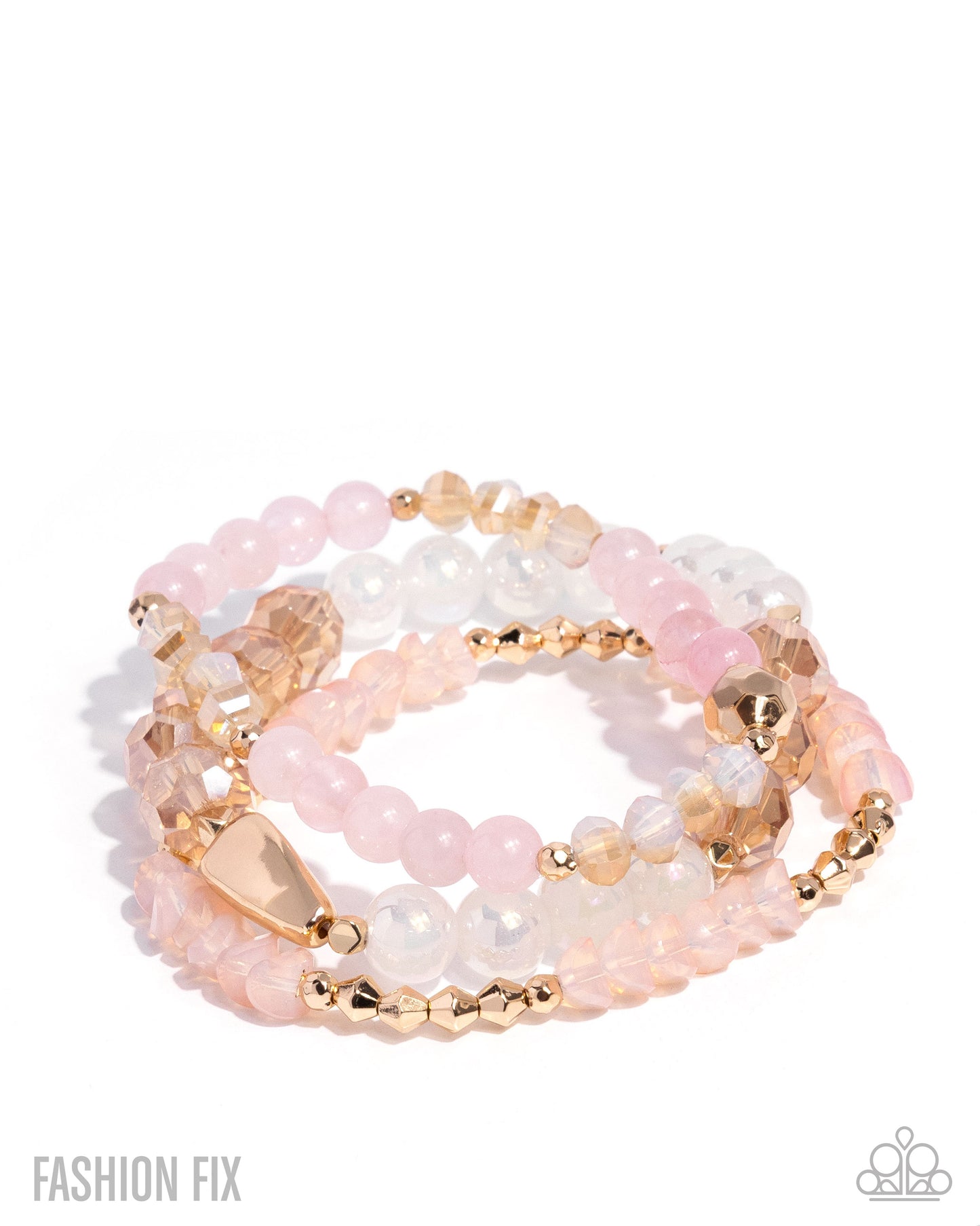 Stack of pink and gold beaded bracelets on a white background