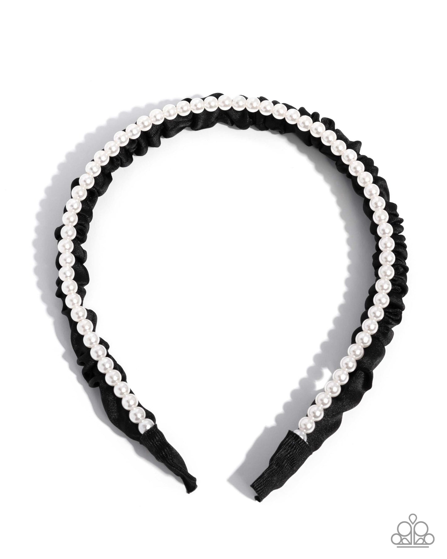 Black headband with white pearls on a white background