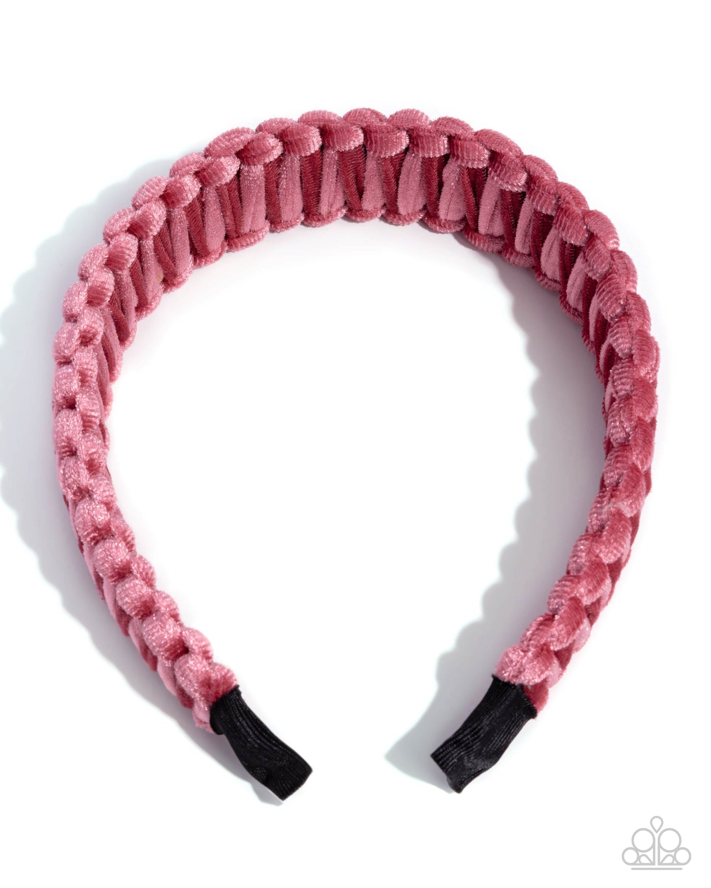 Pink textured headband with black ends on a white background