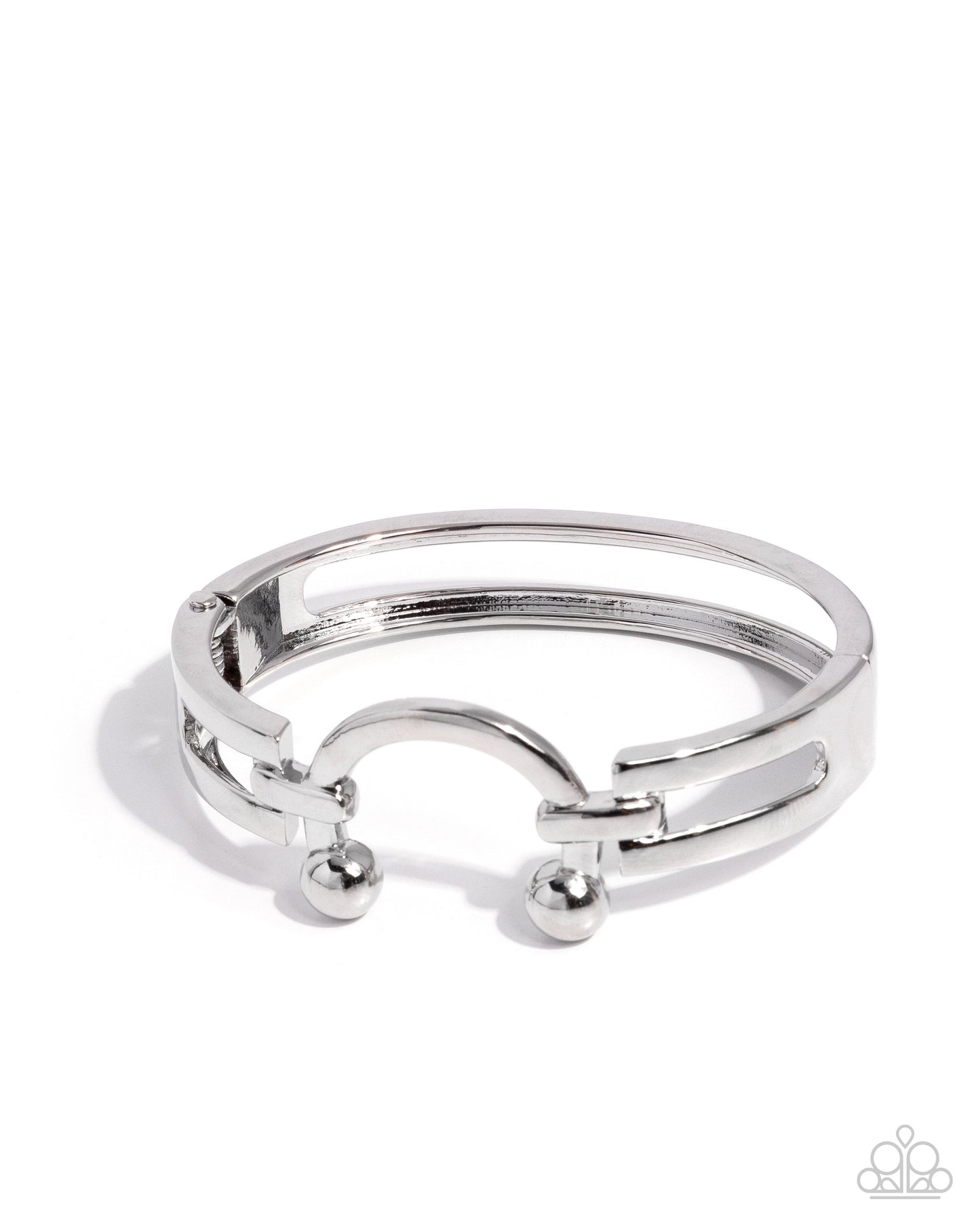 Silver ring with small spherical accents on a white background