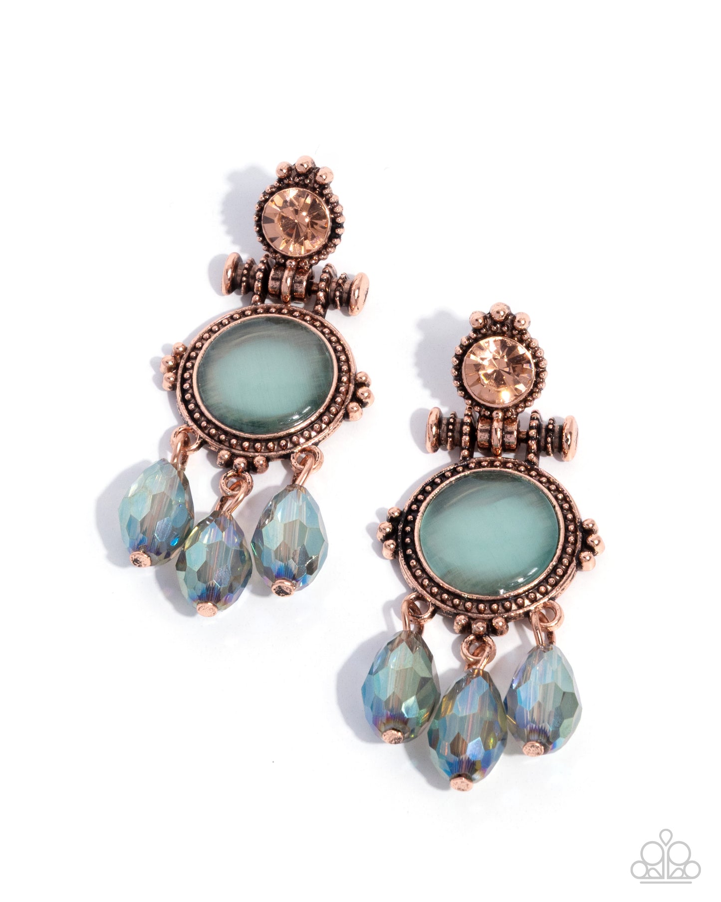 Pair of ornate earrings with rose gold accents and light blue gemstones on a white background