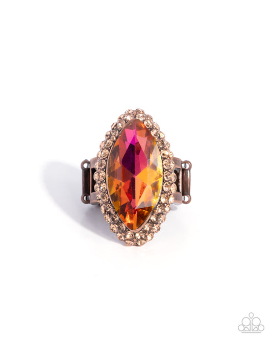 Ring with a multicolored gemstone on a white background