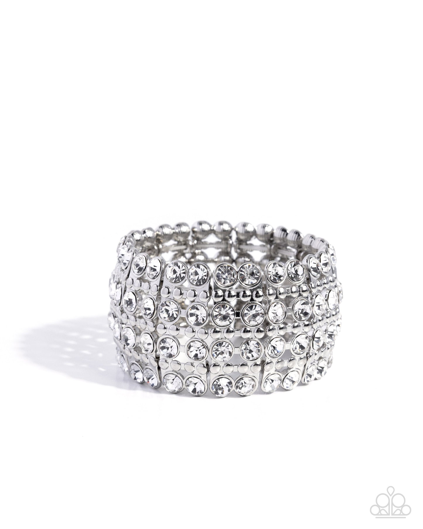 Silver ring with multiple rows of rhinestones on a white background