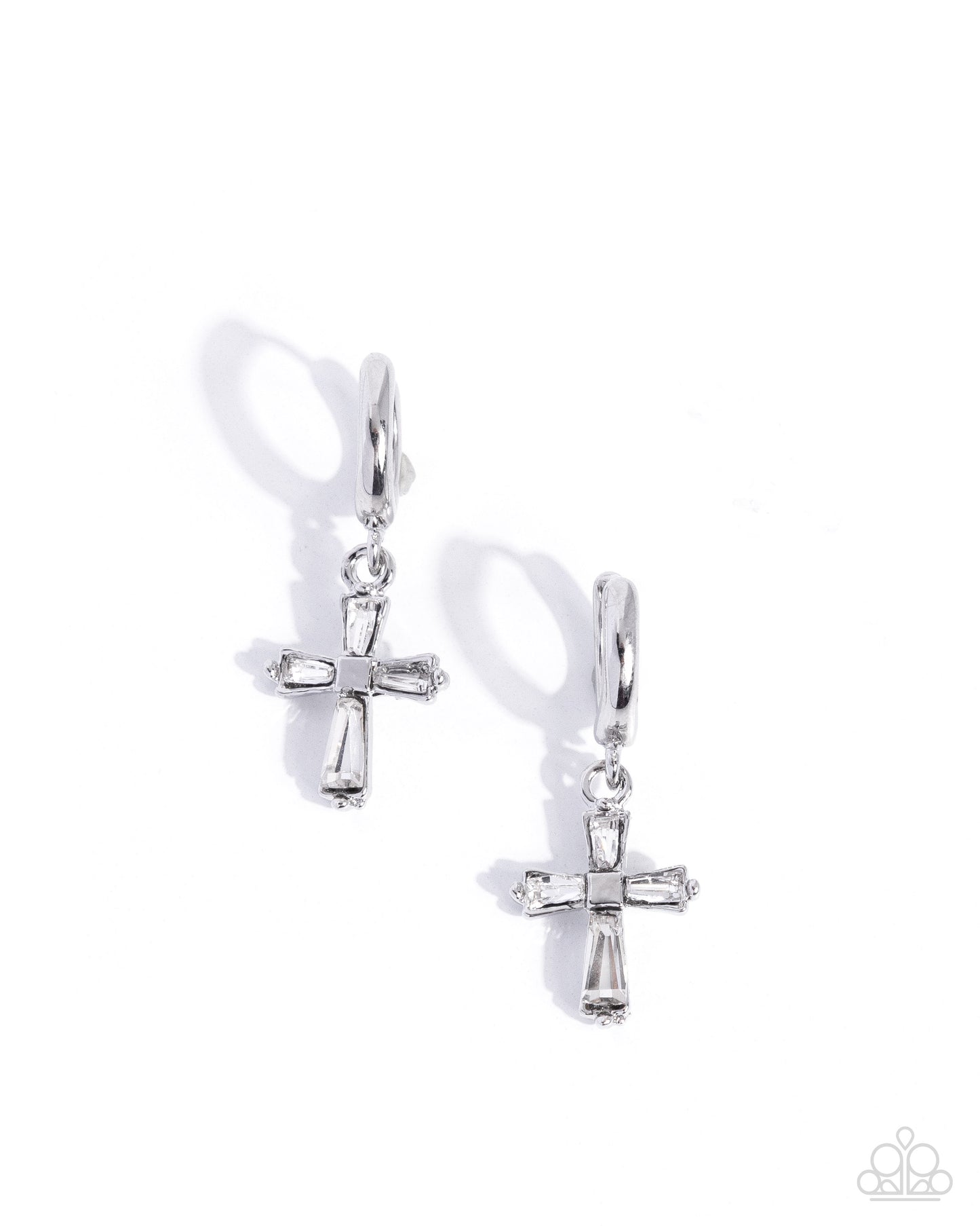 Pair of silver cross earrings on a white background