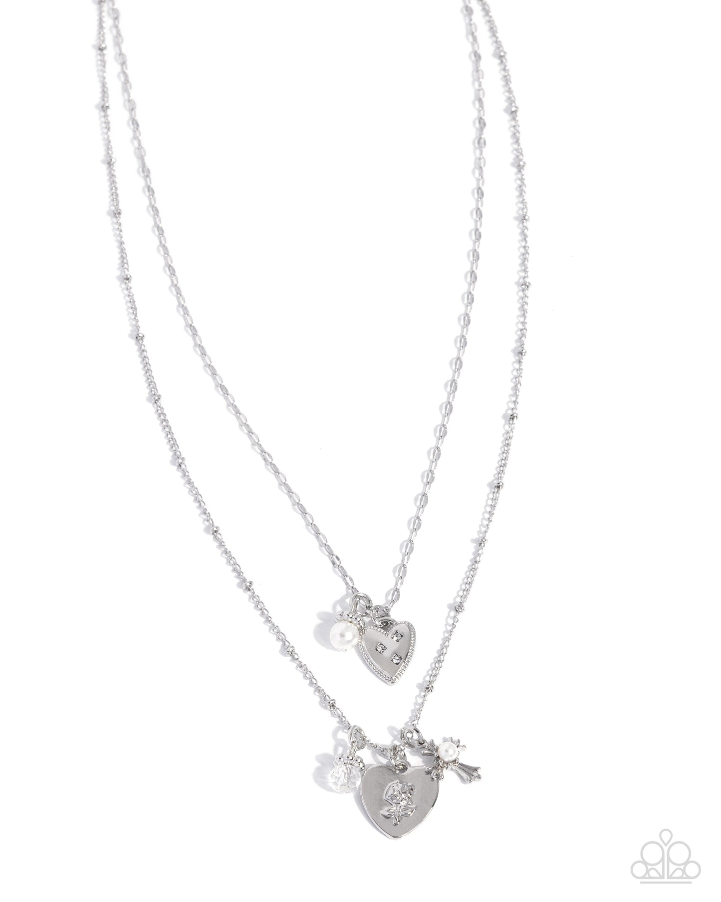 Two silver heart-shaped pendants on a white background