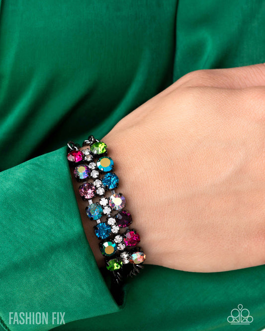 Multicolored beaded bracelet on a wrist with a green background