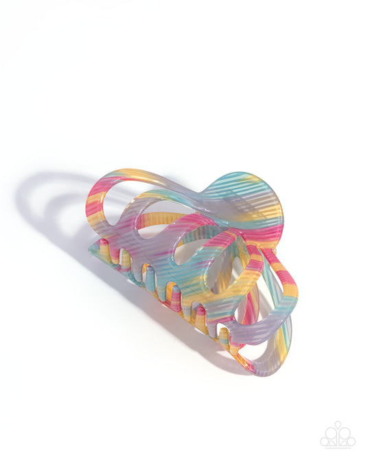 Colorful rubber band holder on a white background