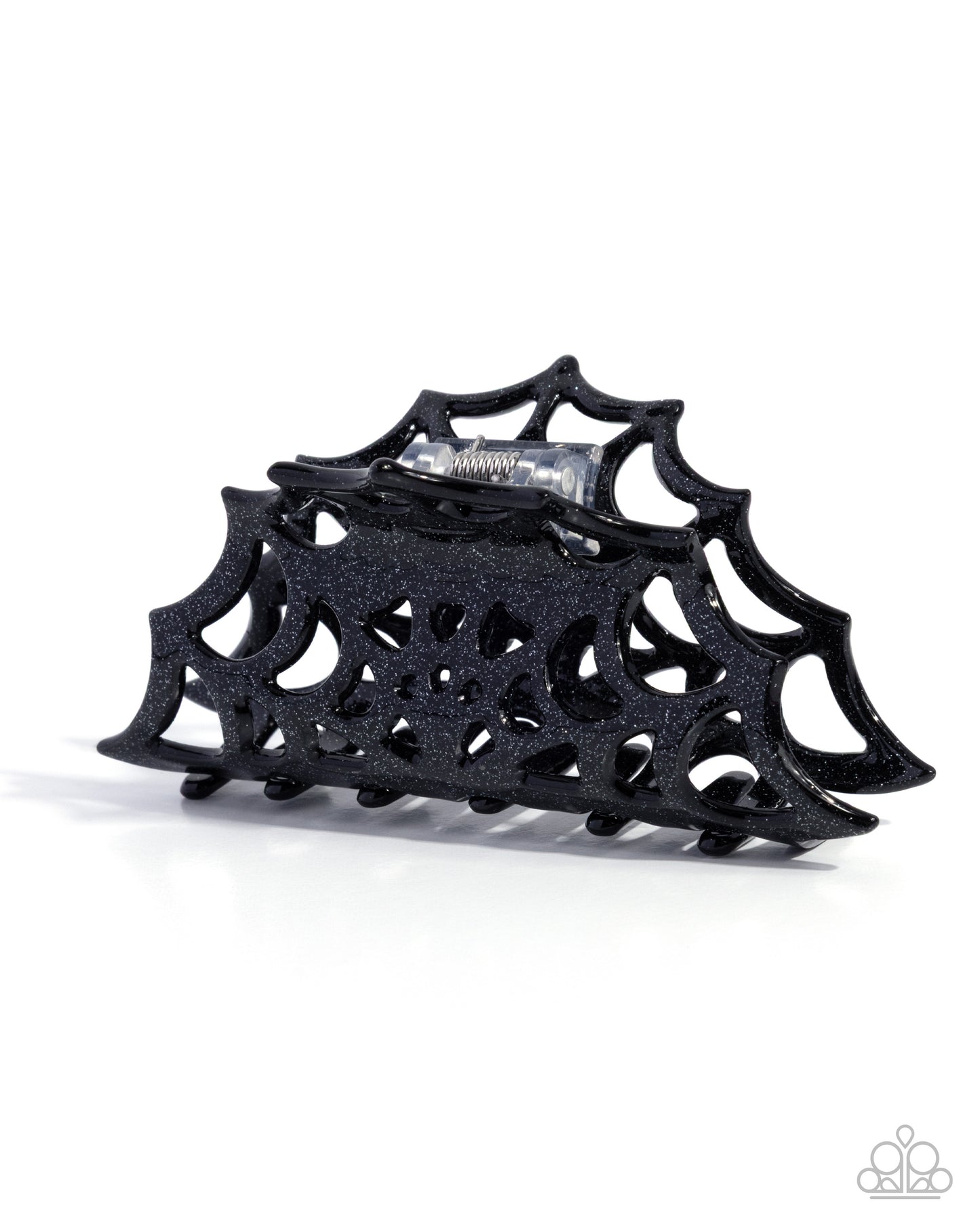 Black spiderweb-shaped hair clip on a white background