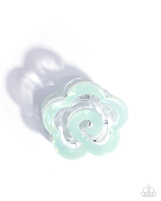 Clear plastic flower-shaped object on a white background