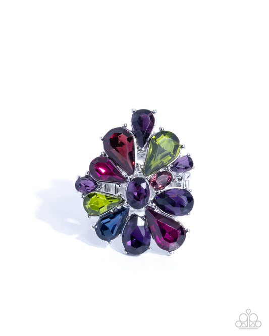 Multicolored gemstone brooch on a white background