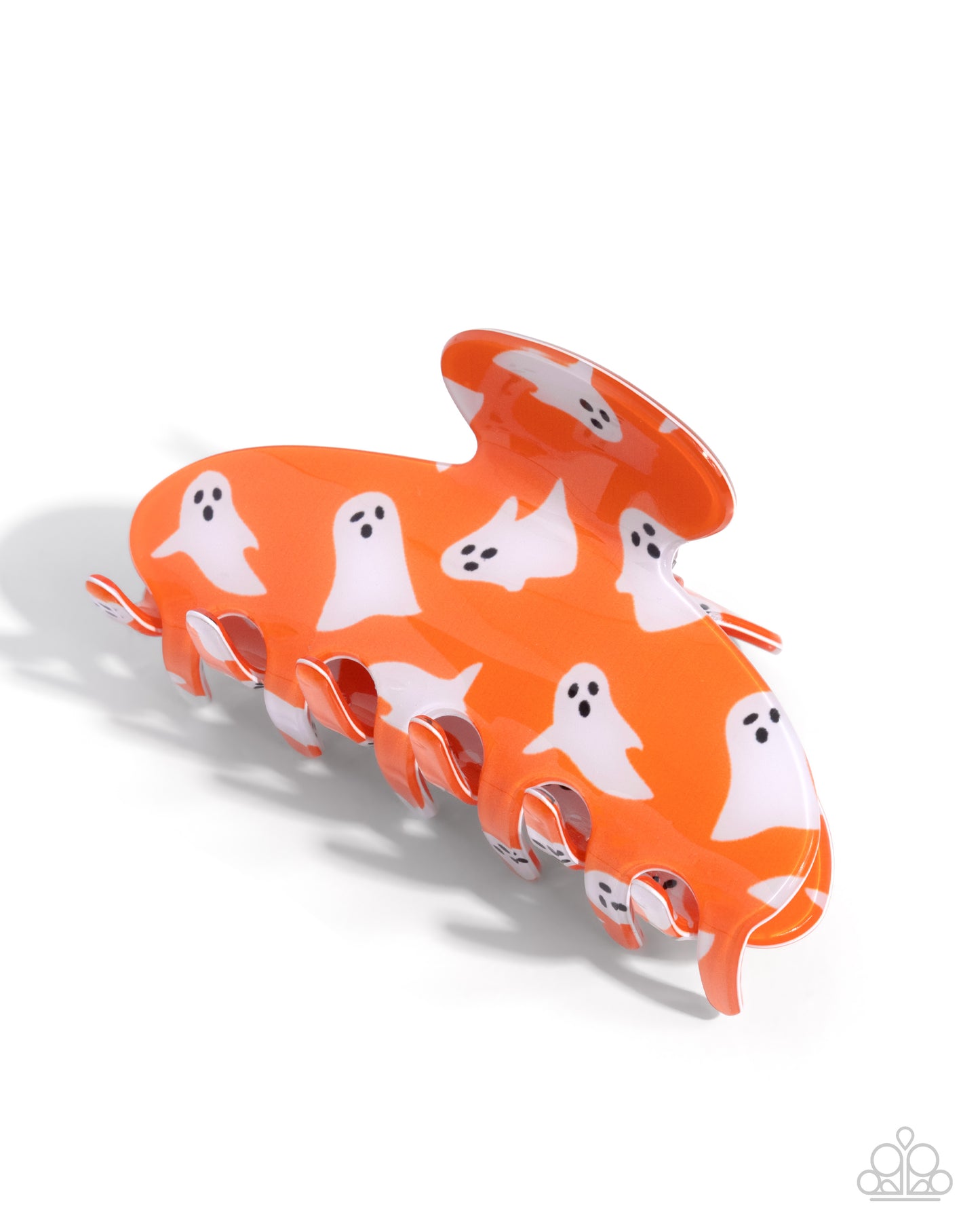 Orange hair clip with ghost pattern on a white background