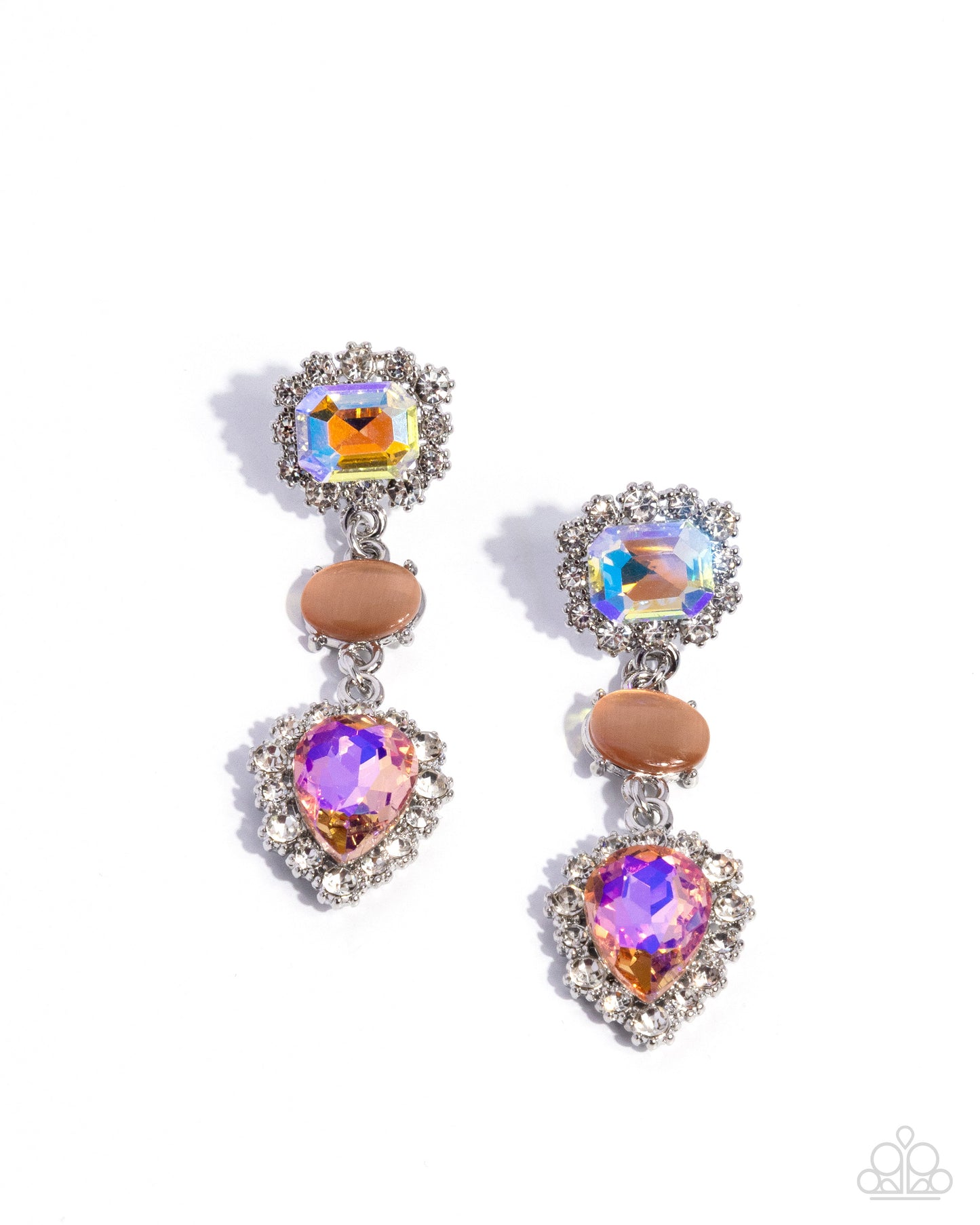 A pair of silver drop earrings featuring a square iridescent crystal, a peach oval stone, and a heart-shaped purple crystal, surrounded by clear rhinestones, on a white background.