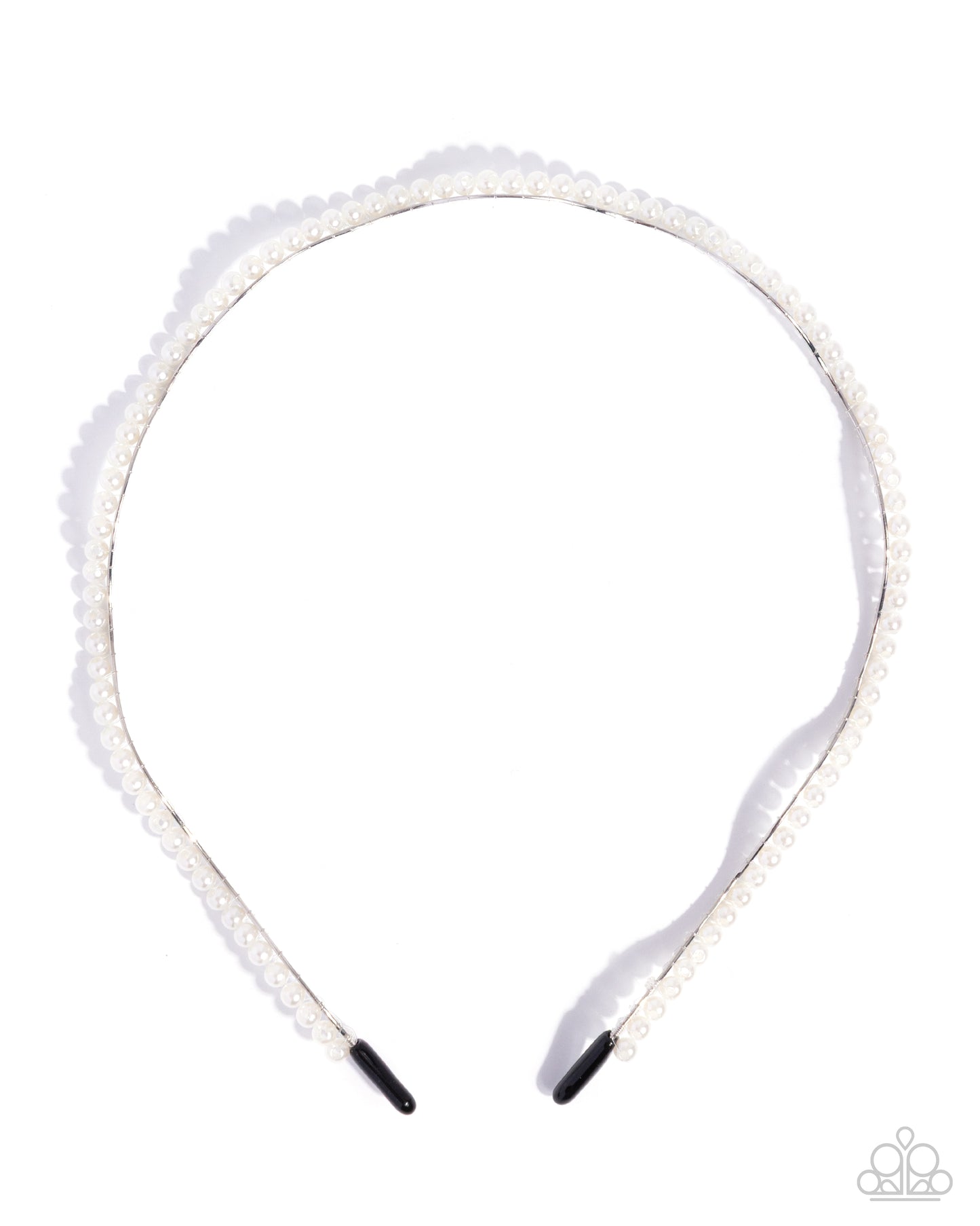 White headband with decorative elements on a white background