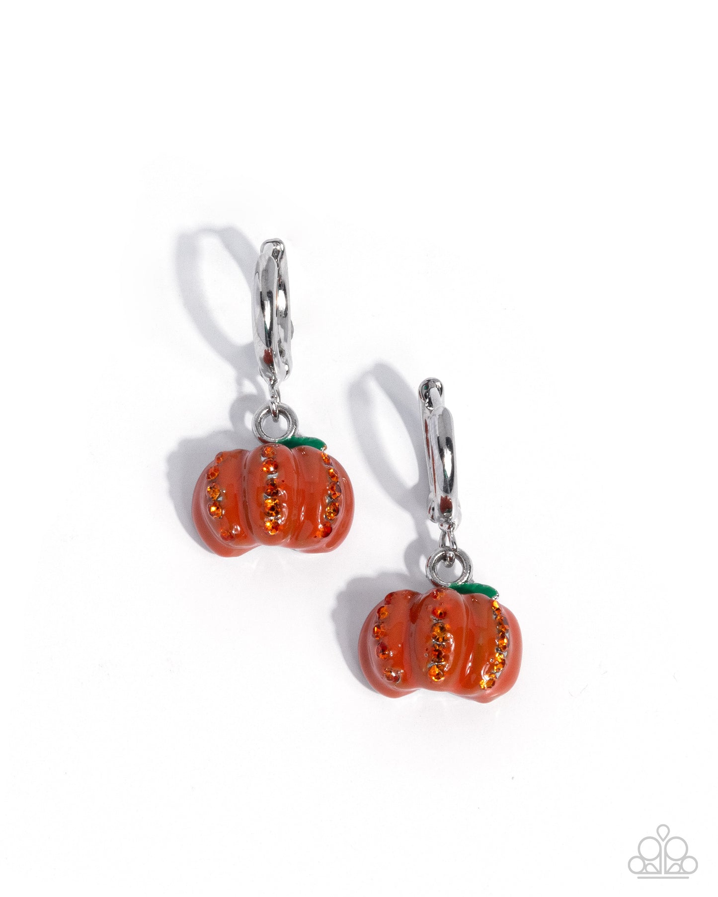 Pumpkin-shaped earrings with orange and green details on a white background