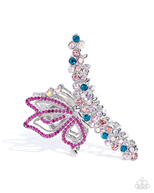 Butterfly-shaped hair clip with colorful gemstones on a white background