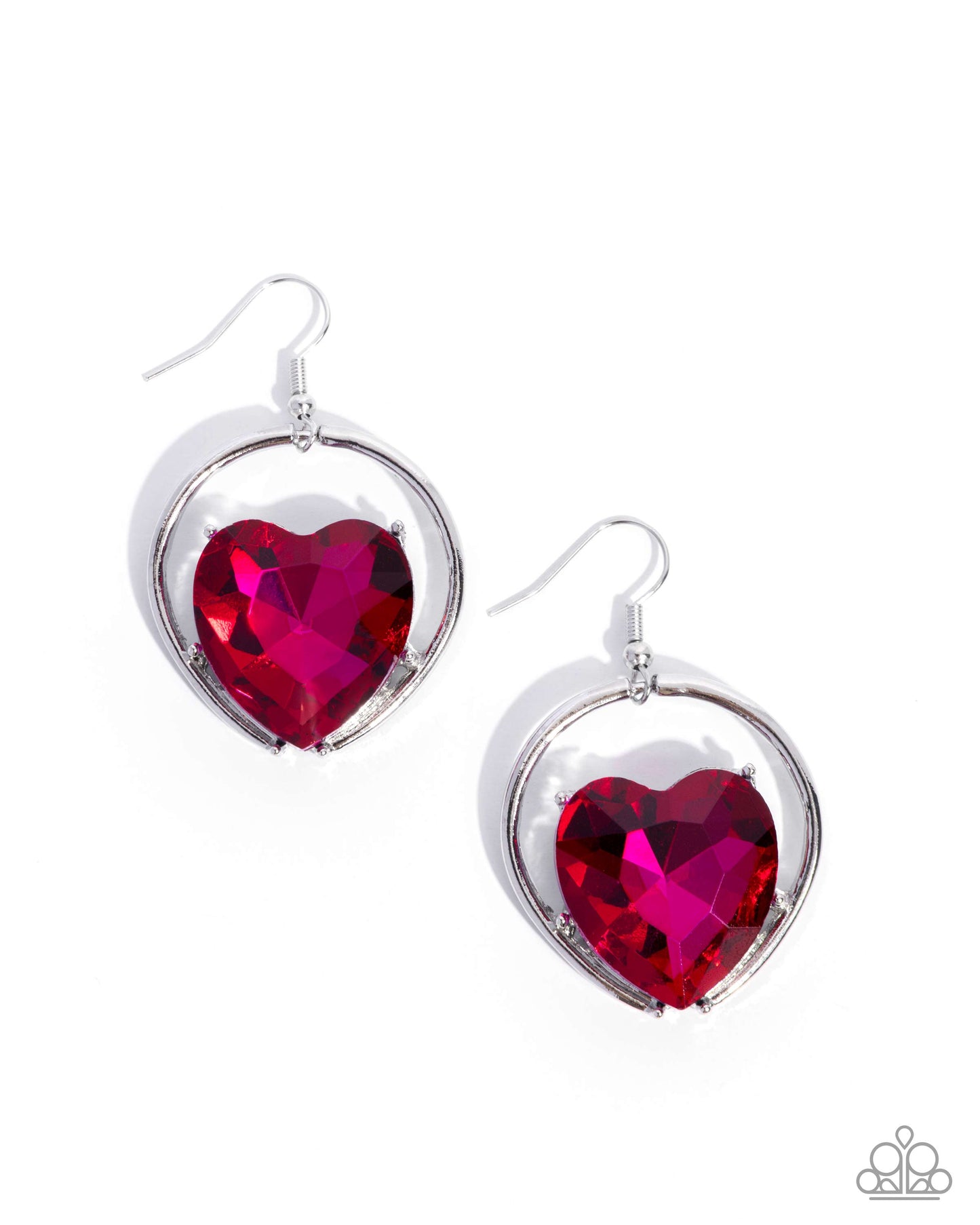 Heart-shaped red gem earrings with silver frames on a white background
