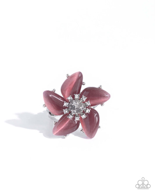 Pink flower-shaped earring with a central gemstone on a white background