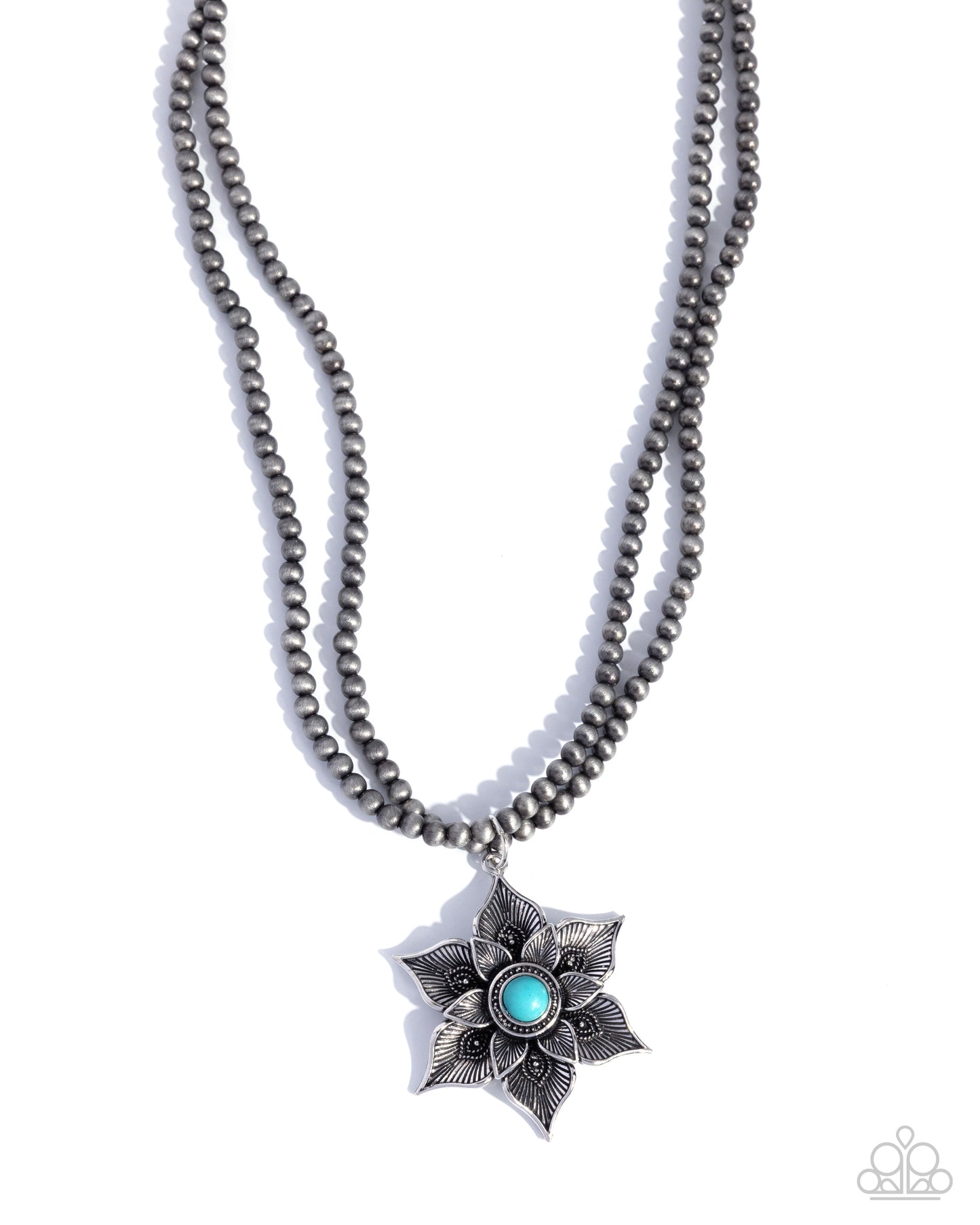 Necklace with star-shaped pendant featuring a blue gemstone on a white background