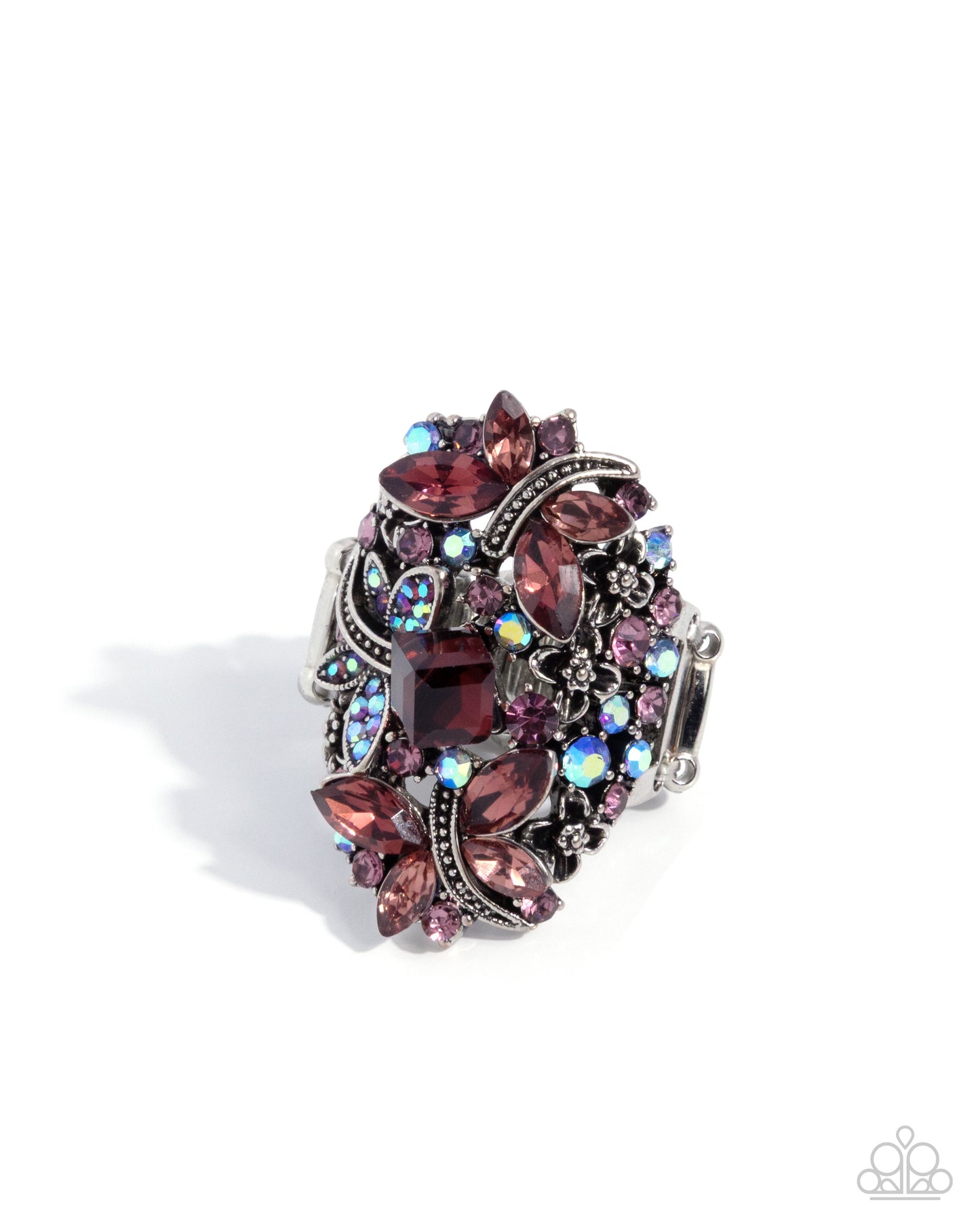 Decorative ring with purple and silver gemstones on a white background
