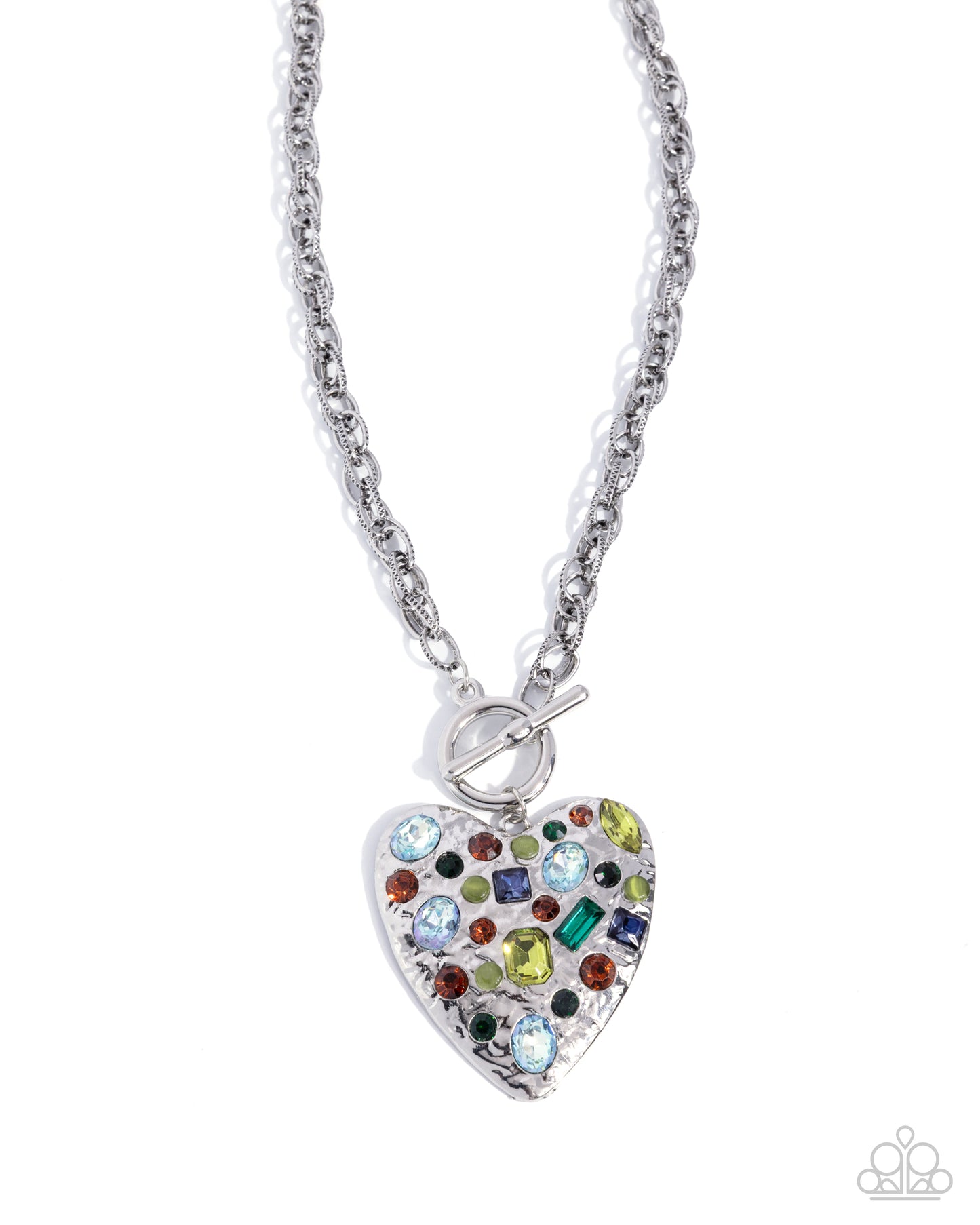 A silver heart-shaped pendant necklace adorned with multicolored rhinestones, suspended from a silver cable chain on a white background.