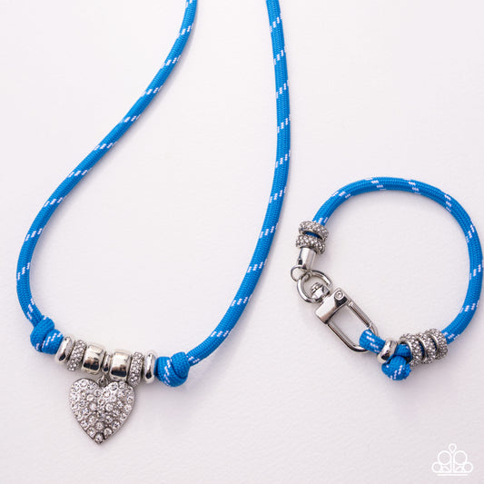 Blue rope necklace with silver heart charm and clasp on a white background