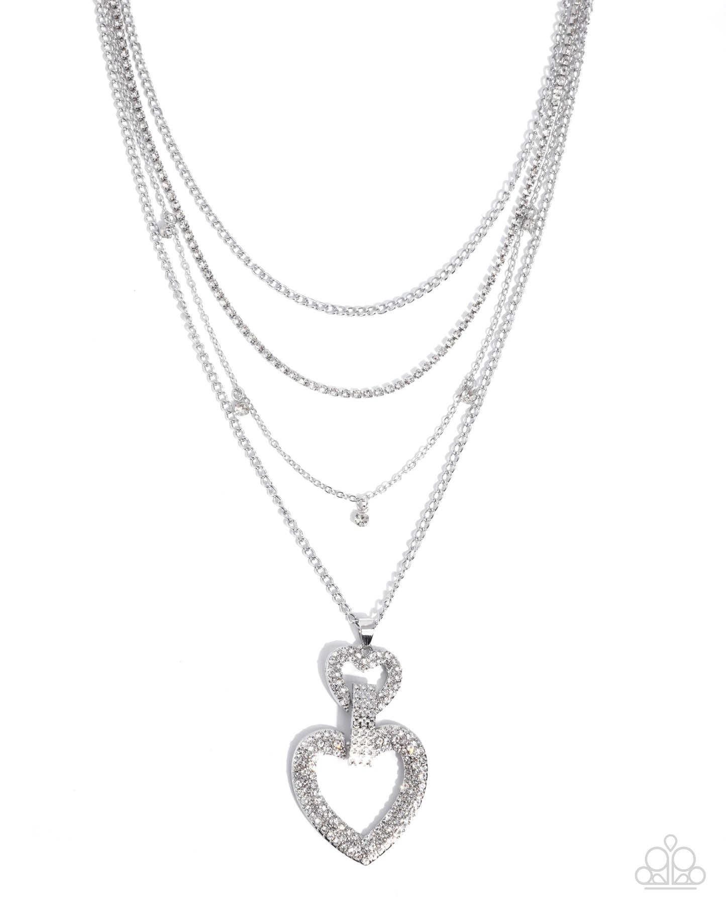 Layered silver necklaces with a heart pendant on a white background