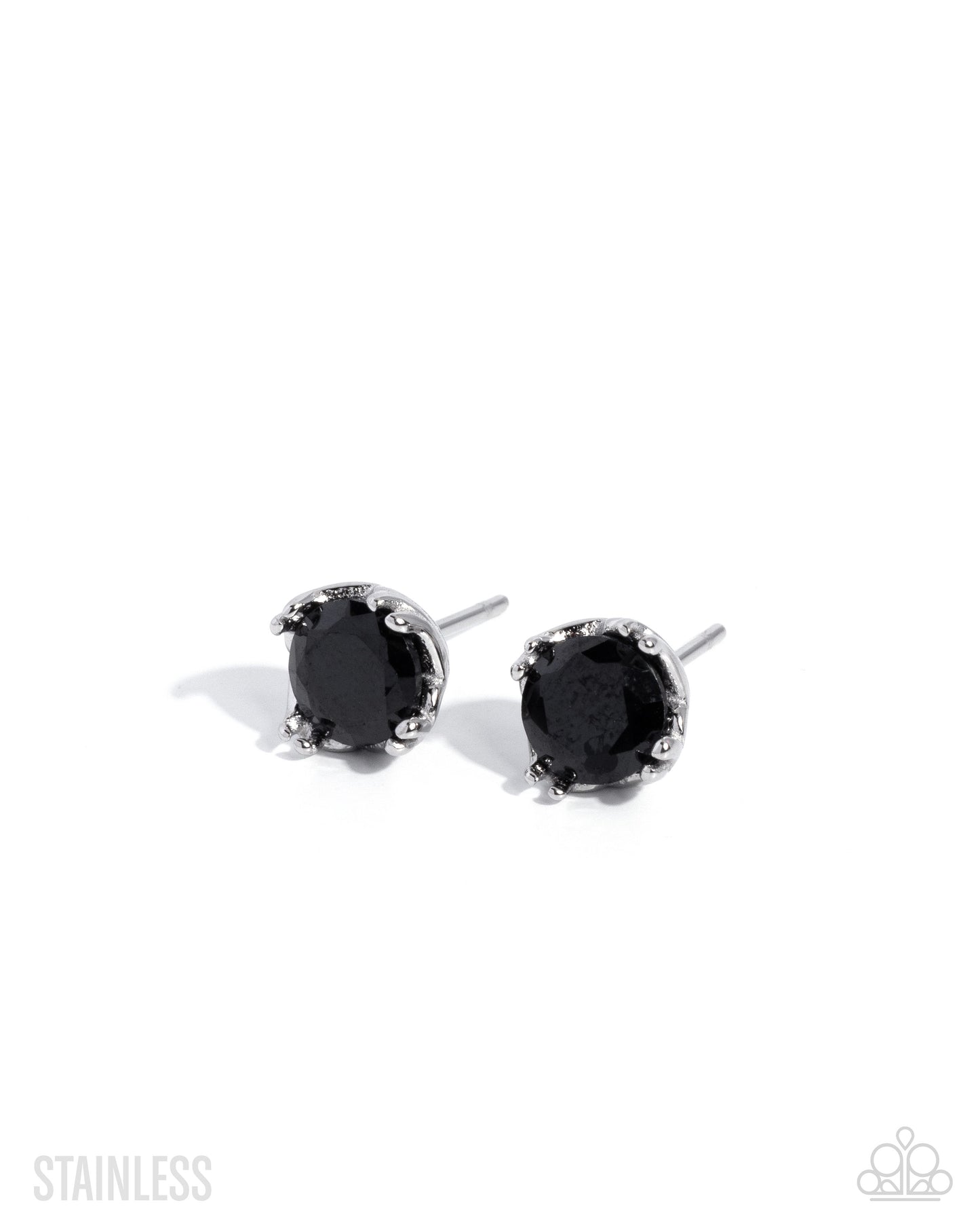 Set of silver earrings on a white background