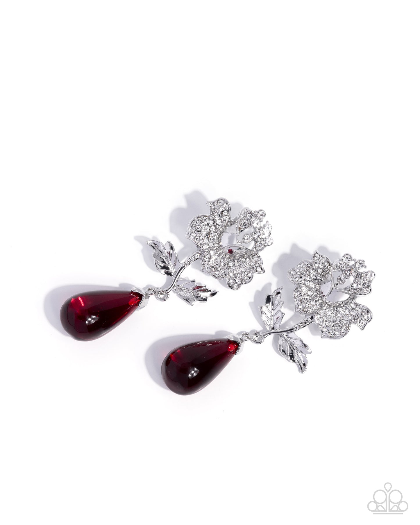 Silver earrings with red teardrop designs on a white background
