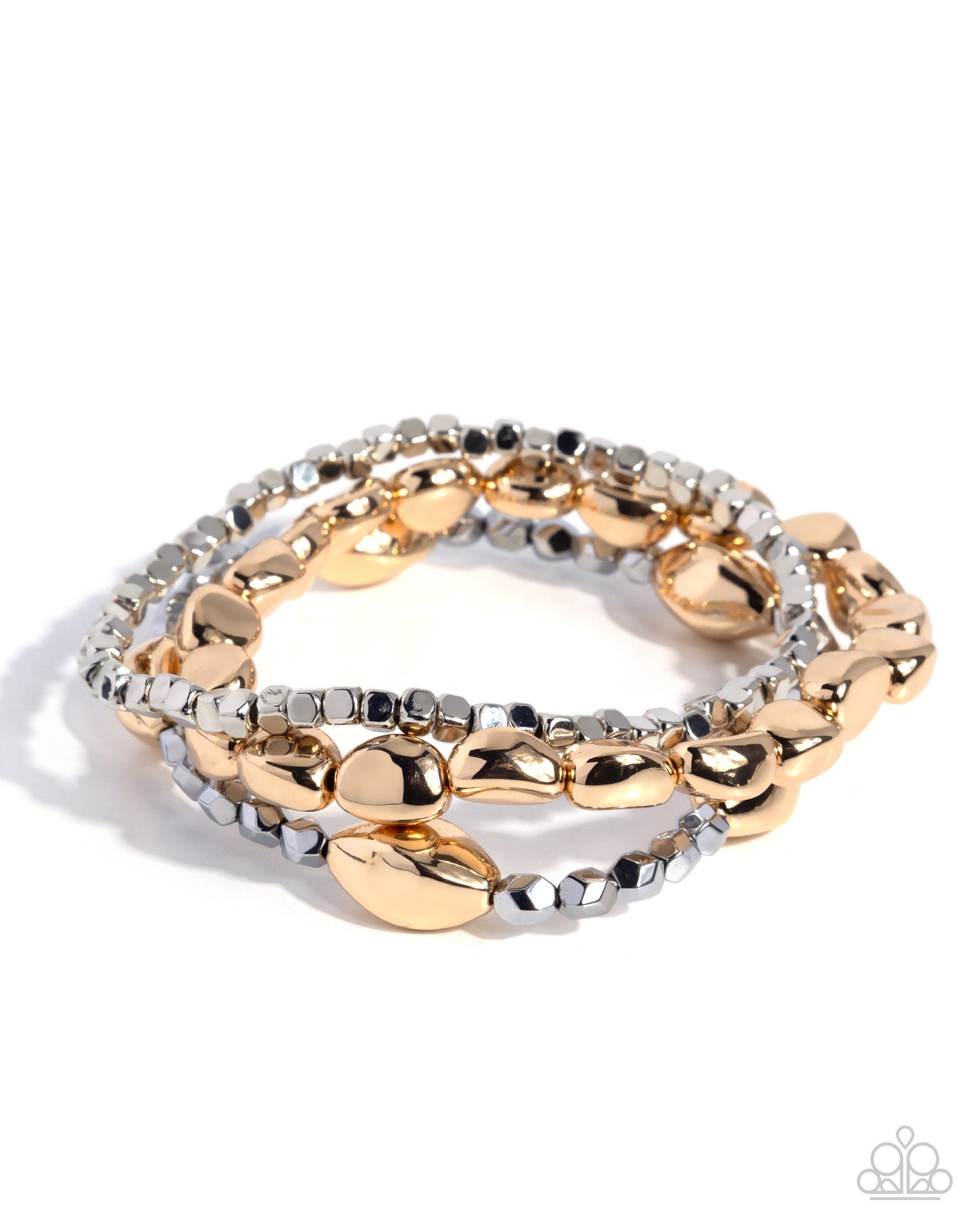 Stack of gold and silver bracelets on a white background