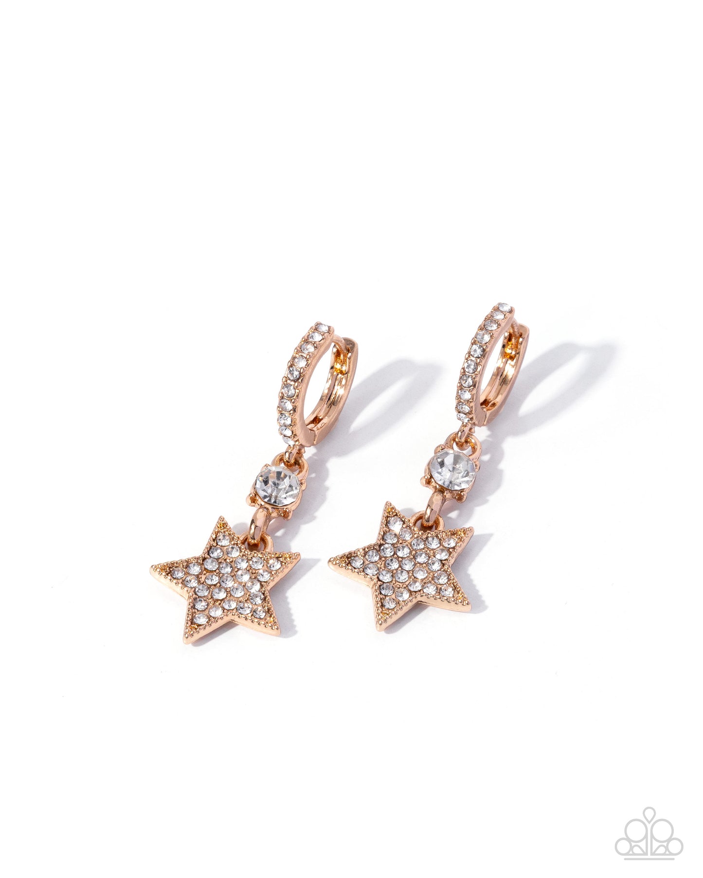 Rose gold star-shaped earrings with clear gemstones on a white background