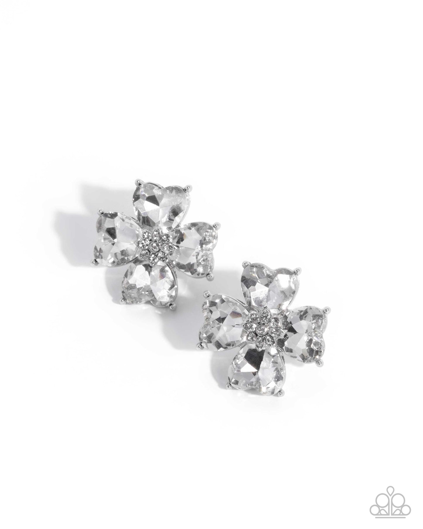 Pair of silver flower-shaped earrings on a white background
