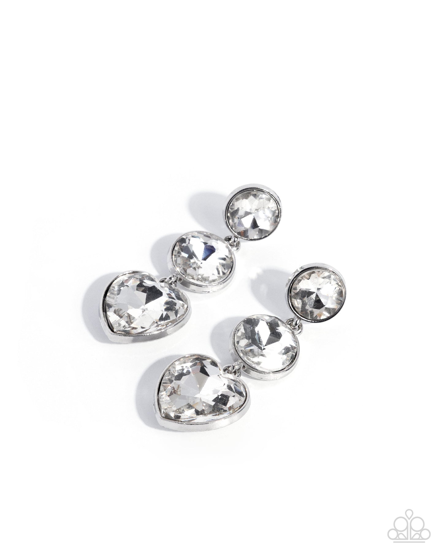 Silver earring with clear gemstones on a white background