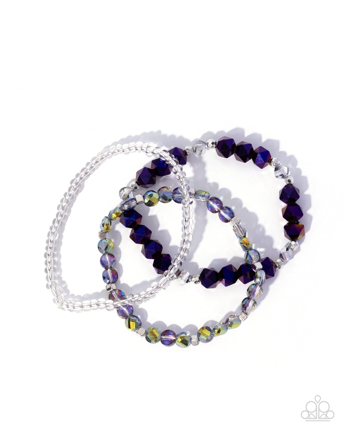 Set of beaded bracelets with purple and clear beads on a white background