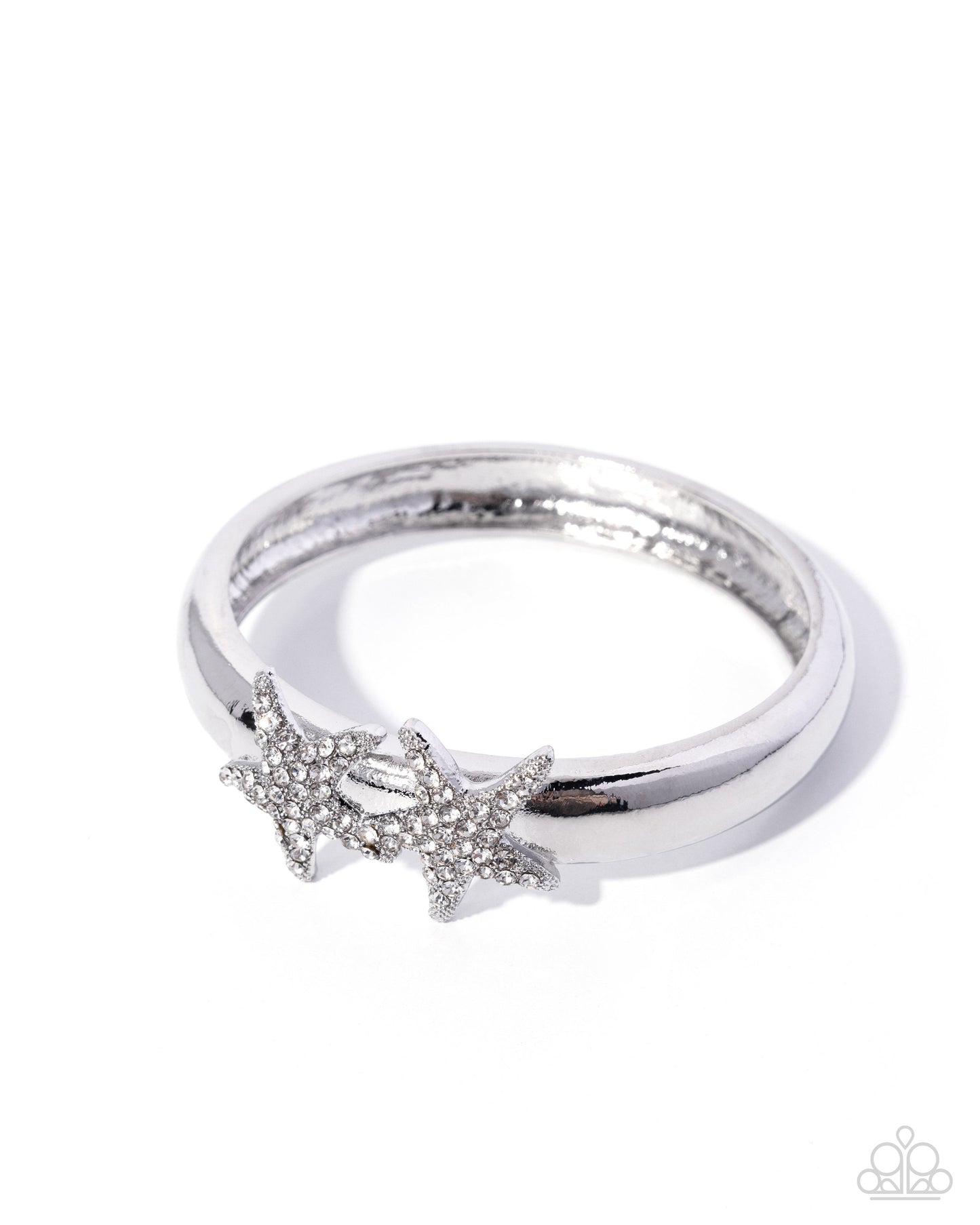 Silver ring with starfish design on a white background