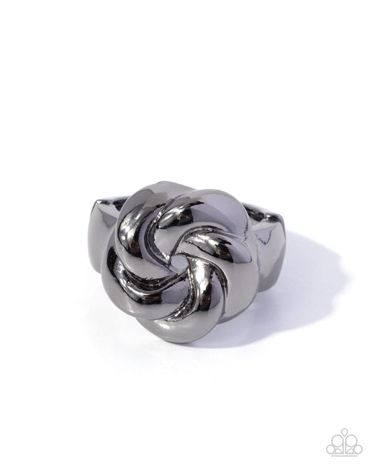Silver knot ring on a white background