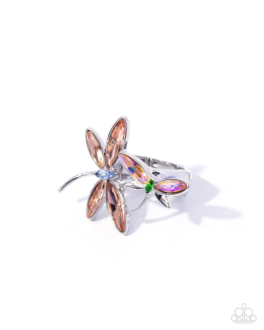 Silver ring with rose gold accents and gemstones on a white background