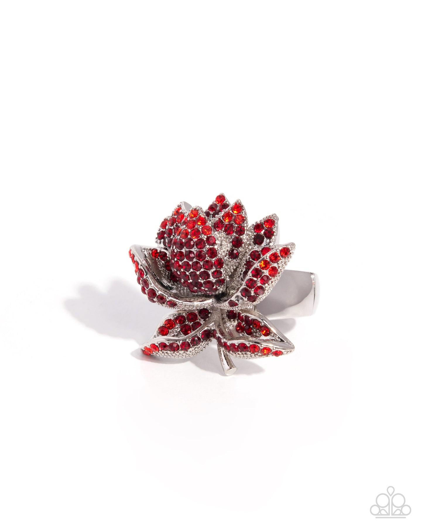 Silver ring with red gemstones on a white background