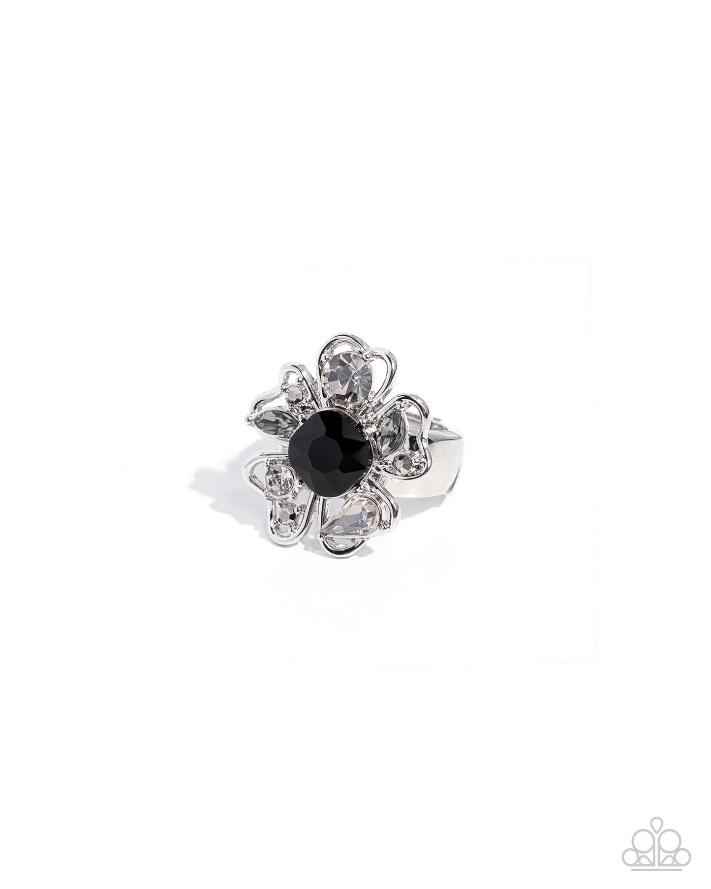 Silver ring with a black gemstone on a white background