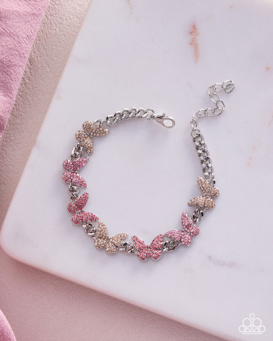 Model wearing Bustling Butterflies pink butterfly bracelet