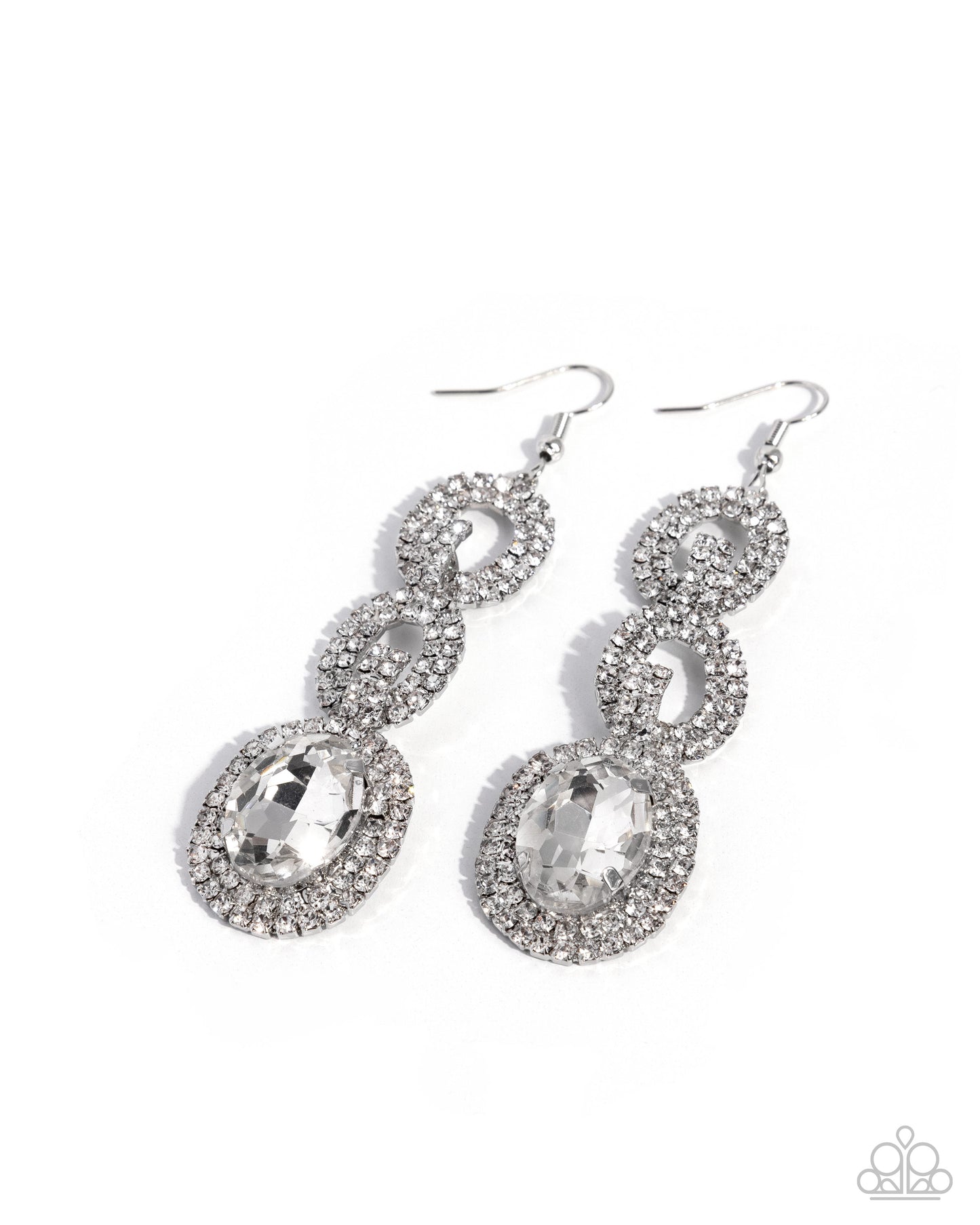 A pair of silver-toned dangle earrings adorned with clear rhinestones and large oval clear gemstones, shown on a plain white background.