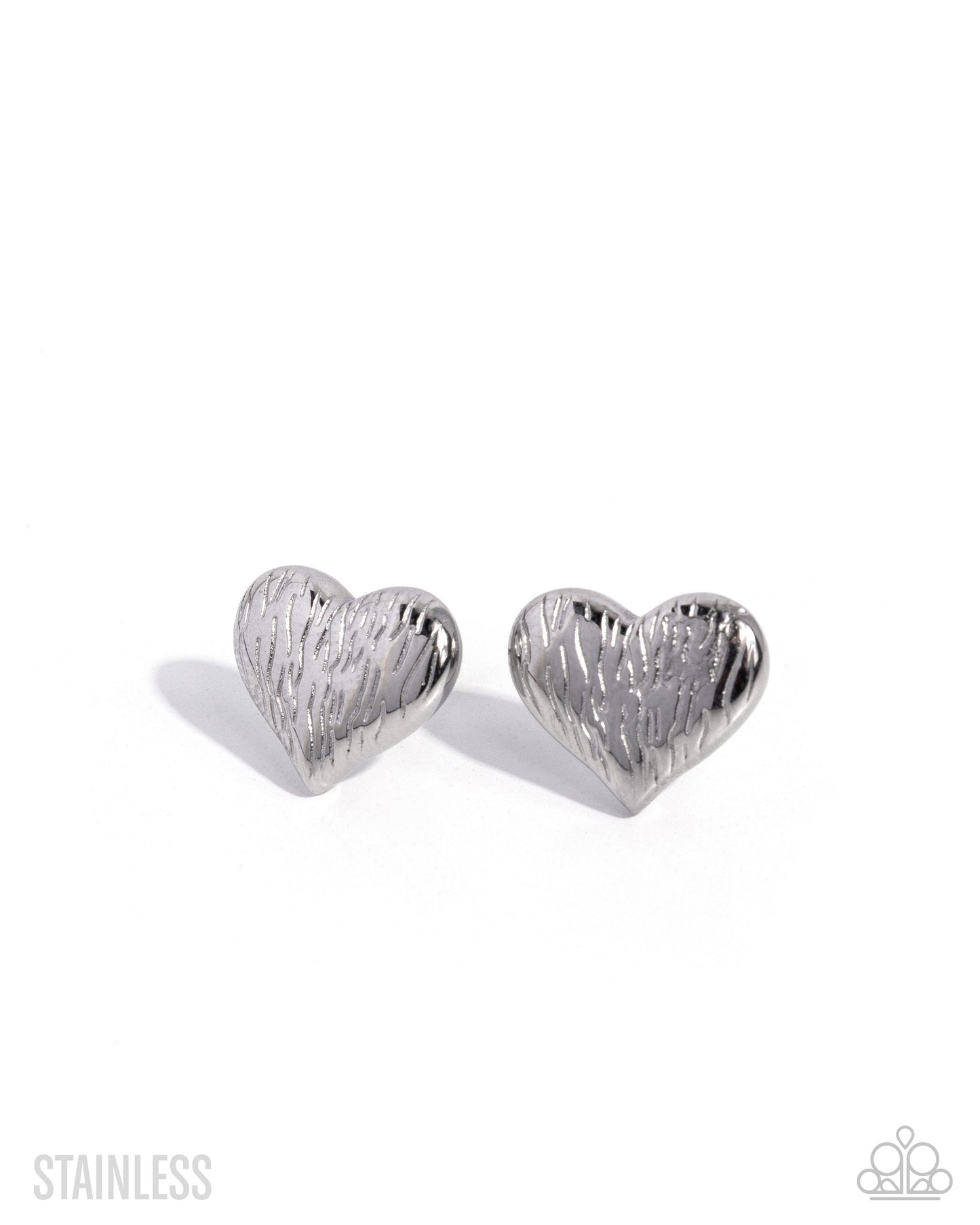 A pair of silver heart-shaped stud earrings with a textured, brushed stainless steel finish, displayed on a clean white background.