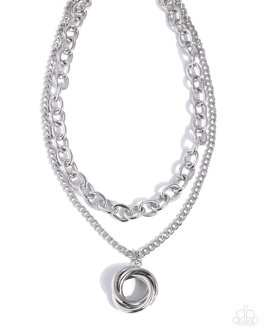 Coiled Credit silver layered necklace with a spiral pendant and cable chain from Jewelry by Bretta