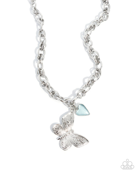 Budget Butterfly silver butterfly pendant necklace with blue cat's eye heart charm - Paparazzi Accessories at Jewelry by Bretta