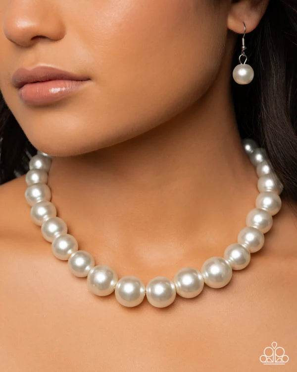 Pearl necklace and earring set on a model