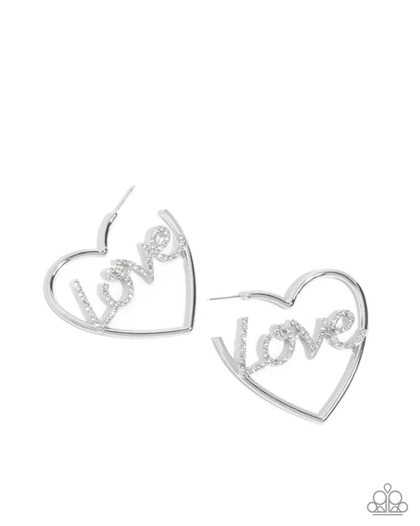 Heart-shaped earrings with 'LOVE' inscription on a white background