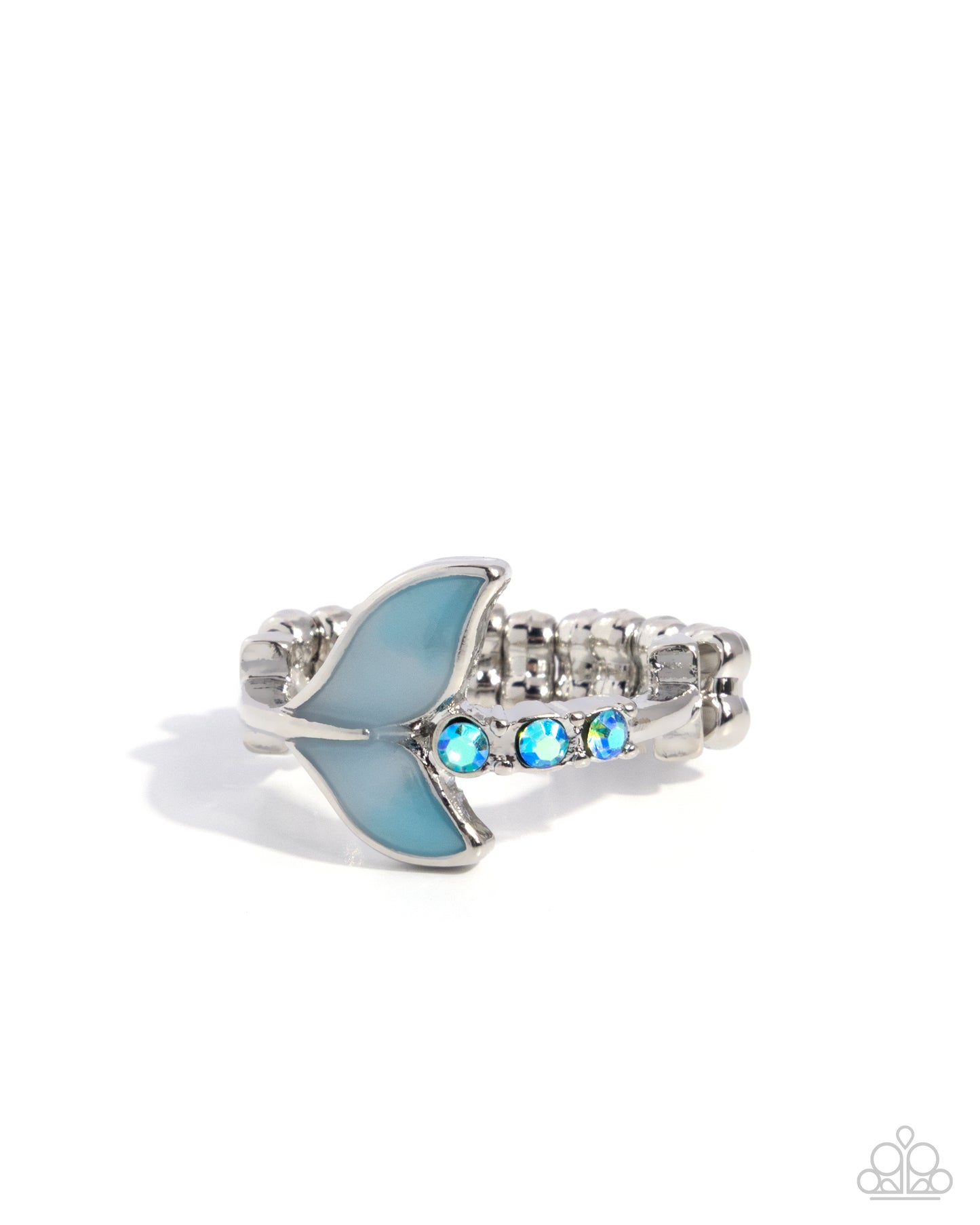 Silver ring with blue fish design and gemstones on a white background